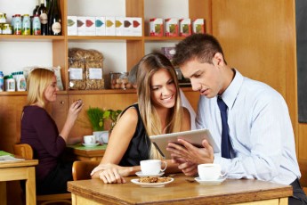 couple looking at tablet-content consumption