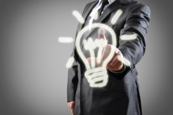 man in suit behind lightbulb sketch