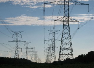 power lines, towers, against the sky