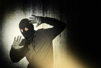 thief caught by flashlight