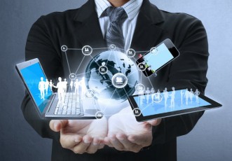 businessman holding laptop-tablet-smartphone-automation