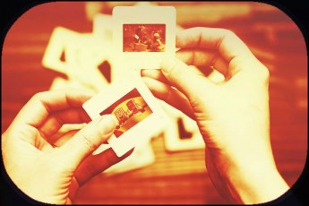 hands holding old-fashioned slides
