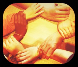 hands joining wrists in circle