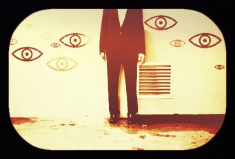 eyes-headless guy standing against wall