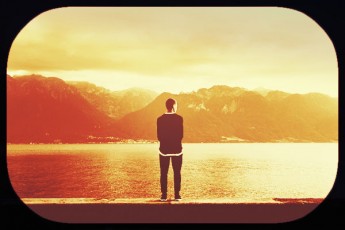 guy viewing water, mountains-scenic