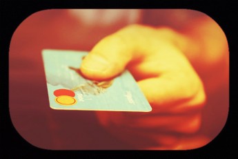 hand holding credit card