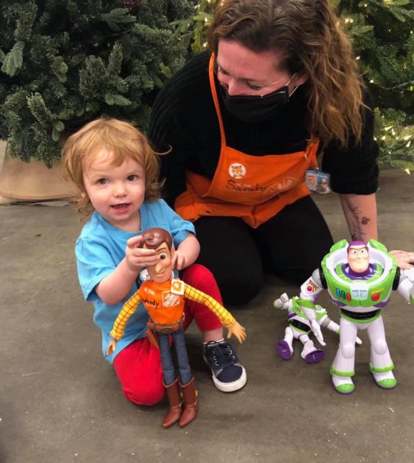 Image showing Wood’s 2-year-old owner, a Home Depot employee and Buzz Lightyear.